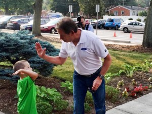 Bill Ford, Ford Motor Co., high-5'ing one of our kiddos