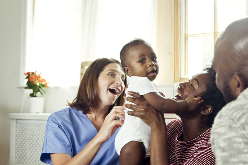 a nurse is giving a presentation at a family oriented