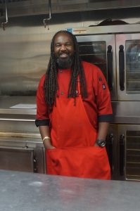 Shaun (aka Superman) smiling in the kitchen.